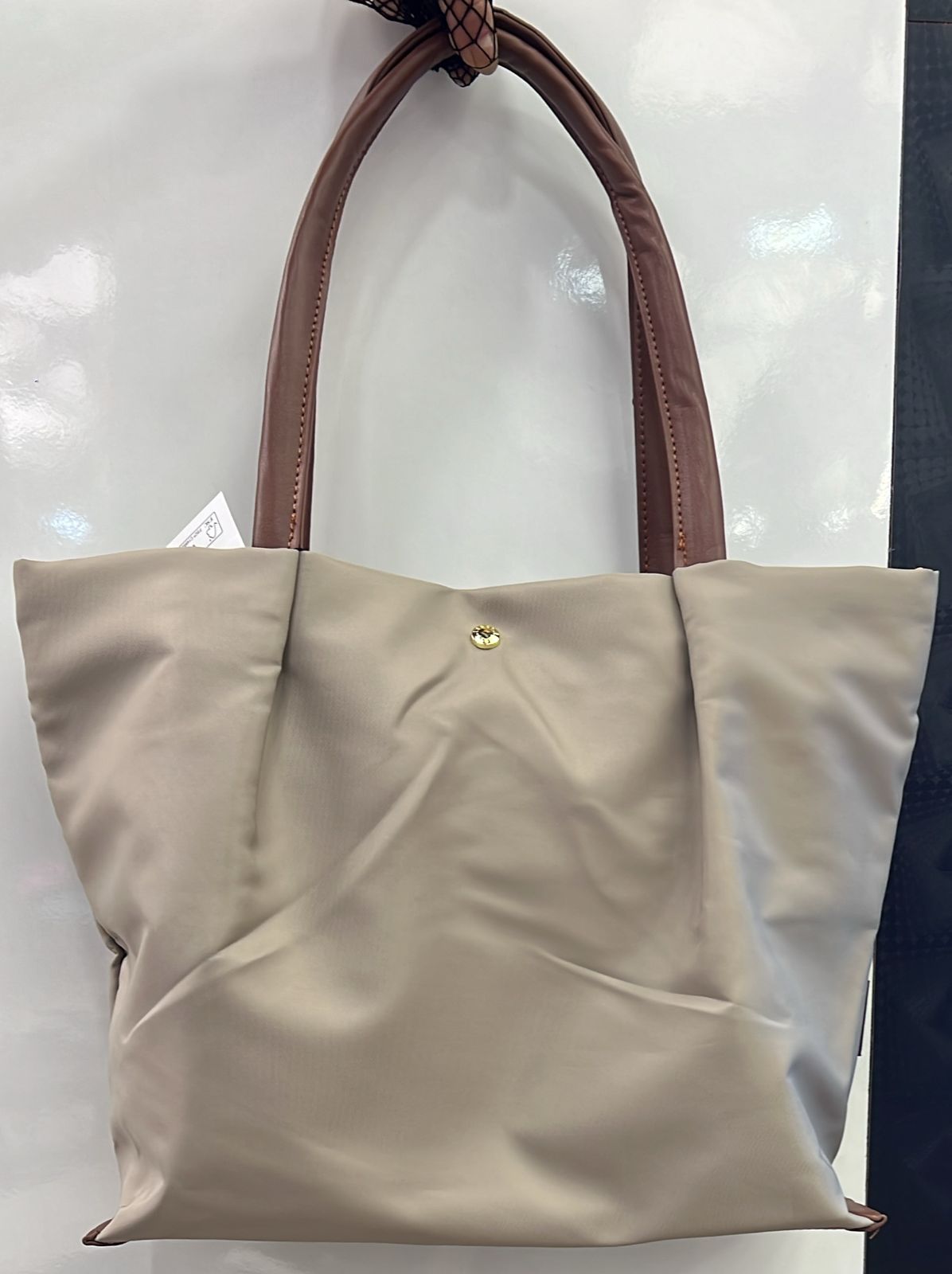 Tote bag with cushioned handles for shoulder comfort