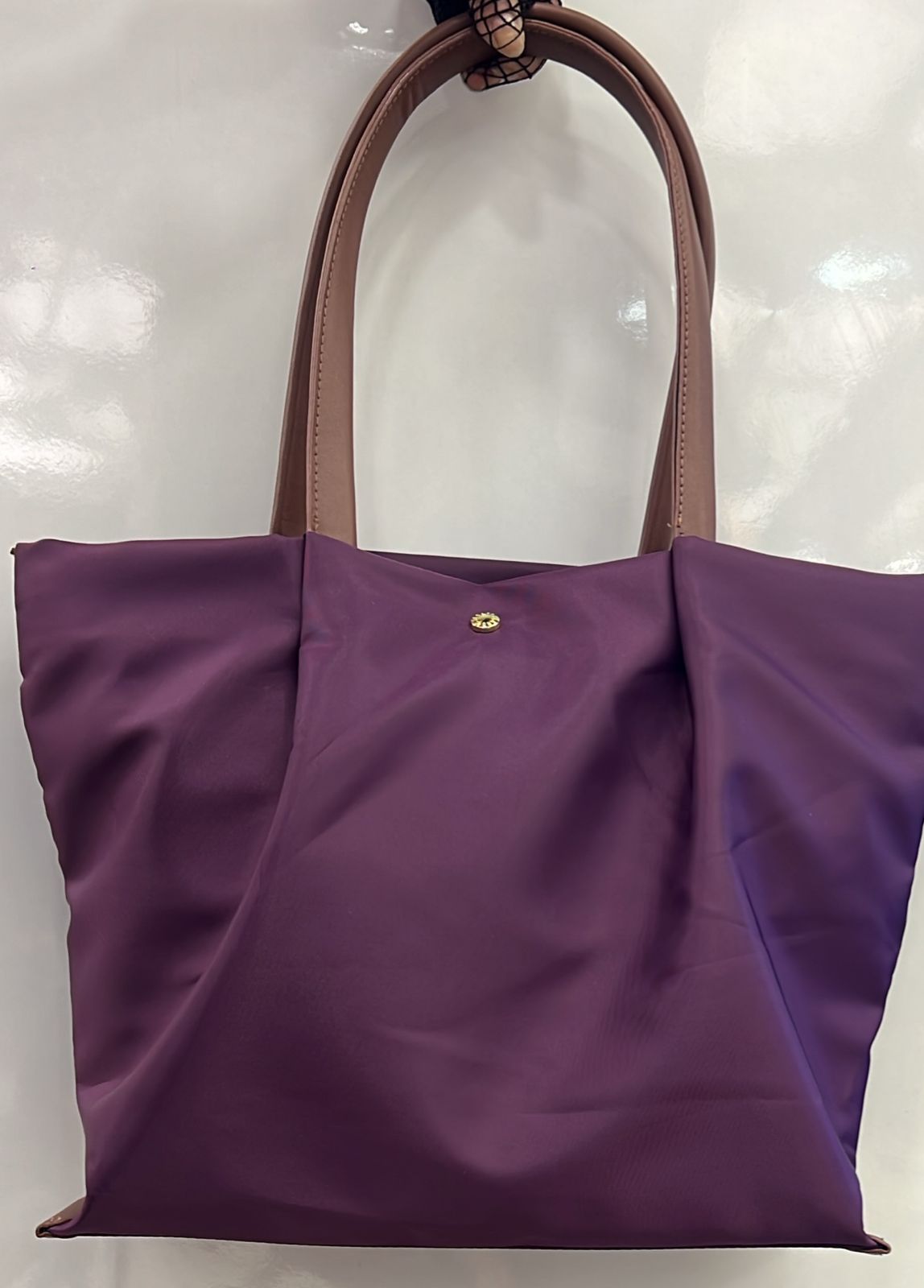 Tote bag with cushioned handles for shoulder comfort