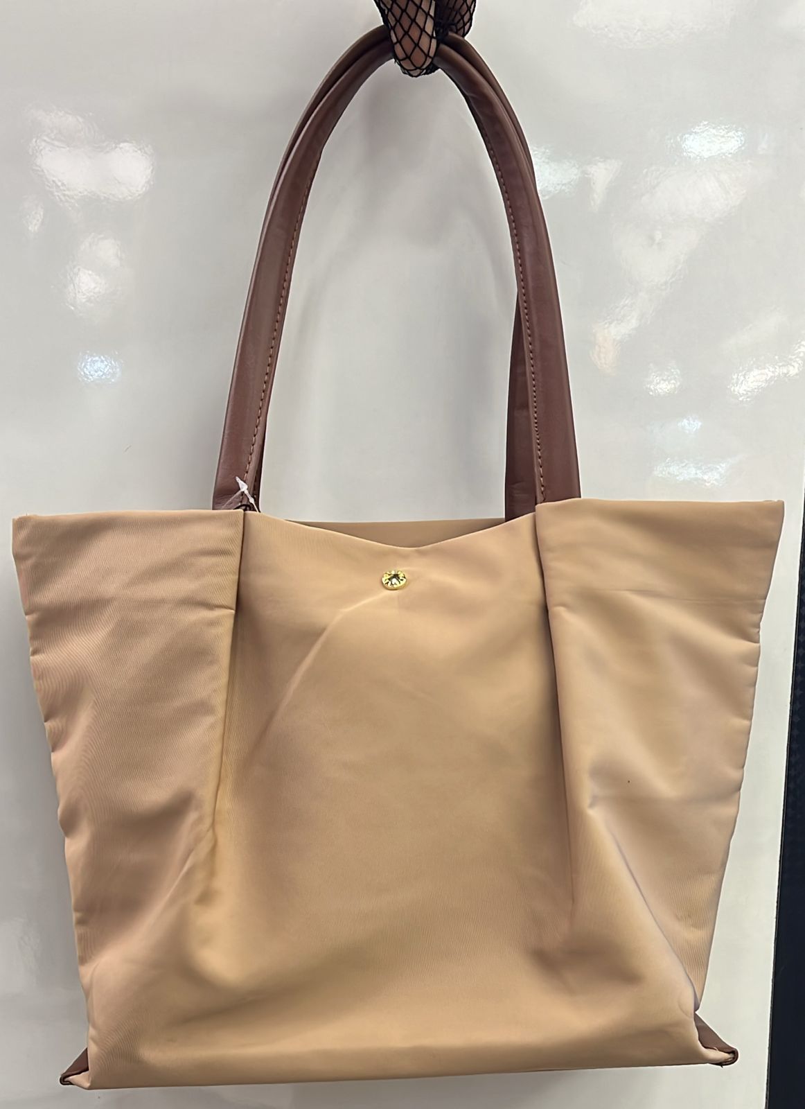 Tote bag with cushioned handles for shoulder comfort