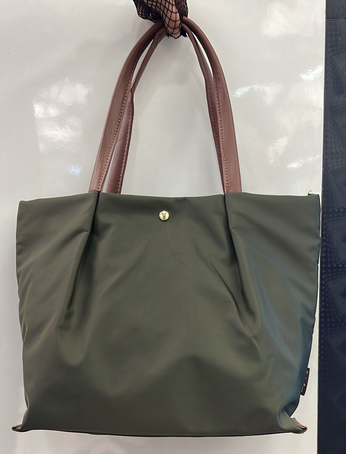 Tote bag with cushioned handles for shoulder comfort